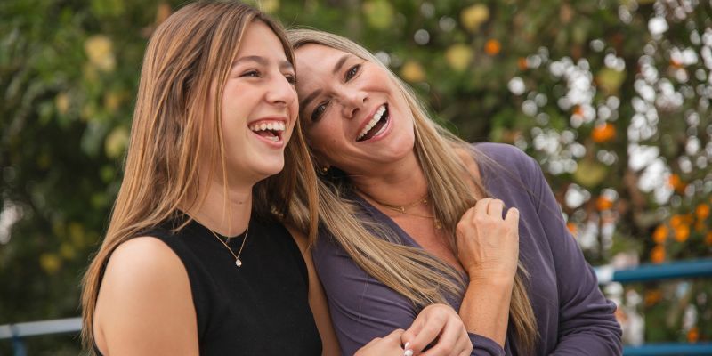 Mother and daughter laughing 